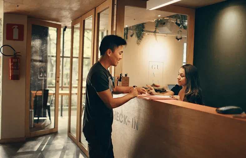 Lime Tree Hotel Golf Course Extension Road Gurgaon - A person checking themselves into a hotel