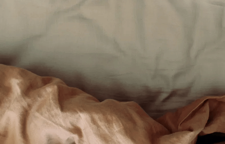 Lime Tree Hotel Golf Course Extension Road Gurgaon- A blown quilt on a comfortable mattress