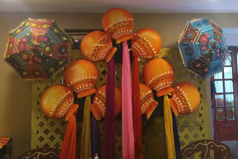 Beautiful indoor decoration with bright, festive umbrellas and elegant drapery at Central Courtyard Boutique Hotel.