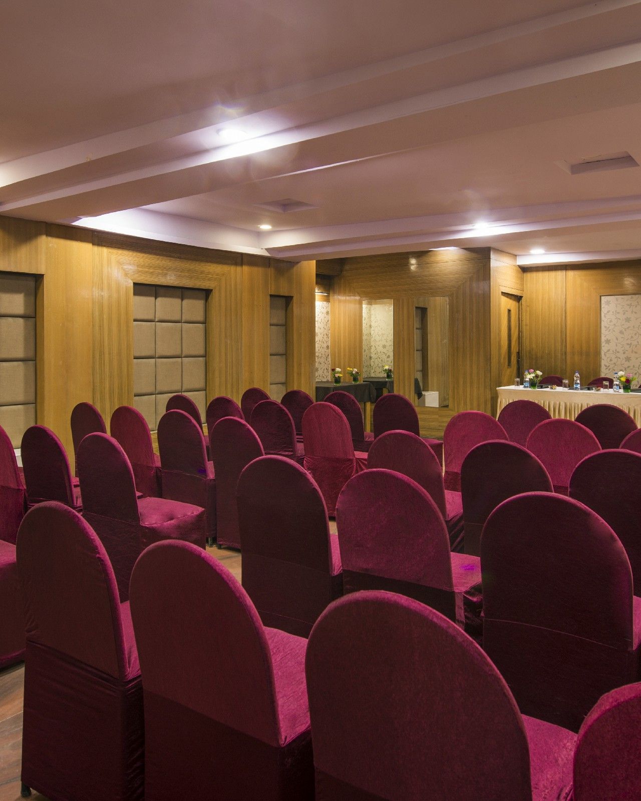 Conference room at Lords Eco Inn Dahej with theatre-style seating and modern presentation setup.