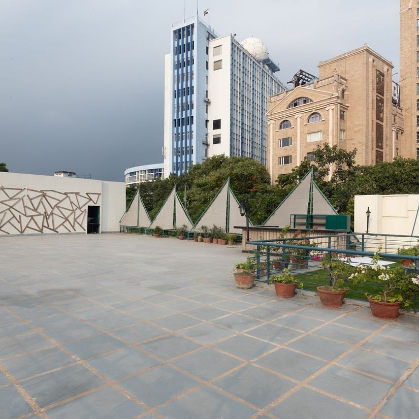 an empty tiled land as the external event area at Polo Floatel Kolkata