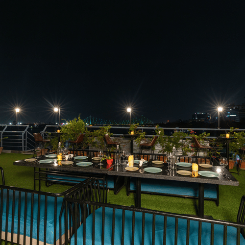 one of the open air decks with seating arrangements at Polo Floatel Kolkata