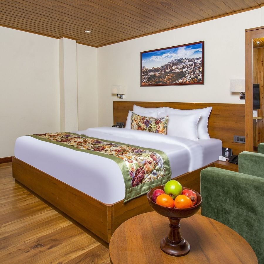 Side view of Suite With Balcony room with a cosy bed at Mount Lungta Boutique Hotel & Spa