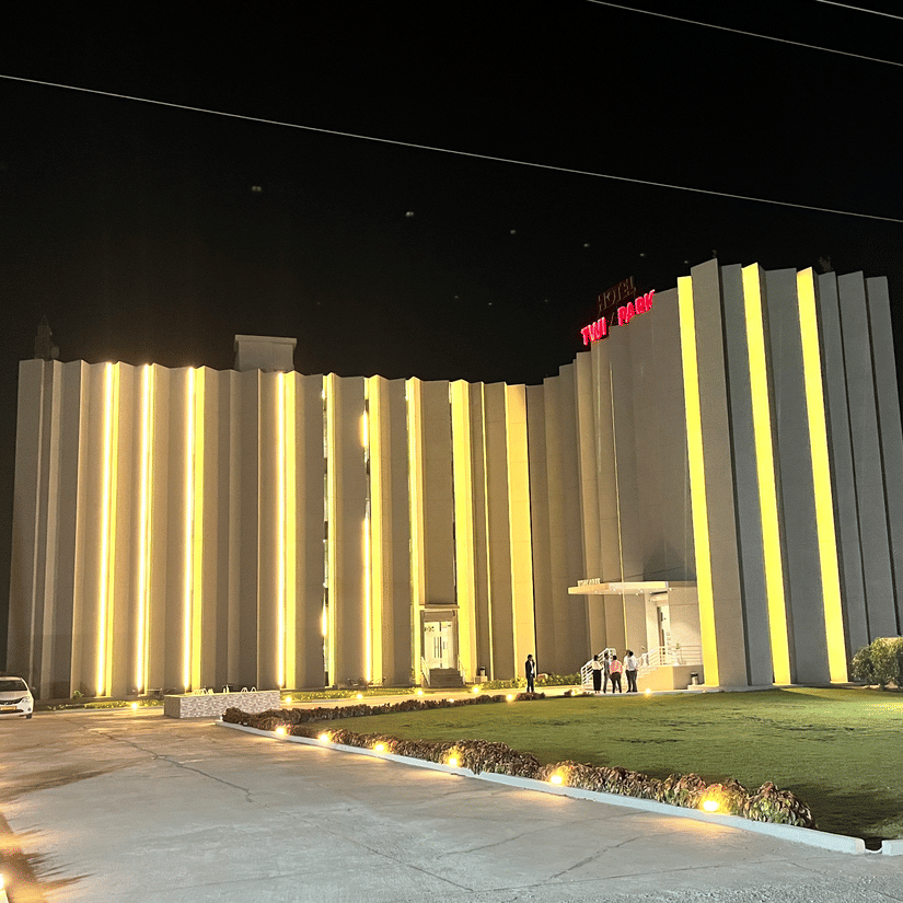 Facade of VITS Jamnagar, Mithoi at night with the lights on.