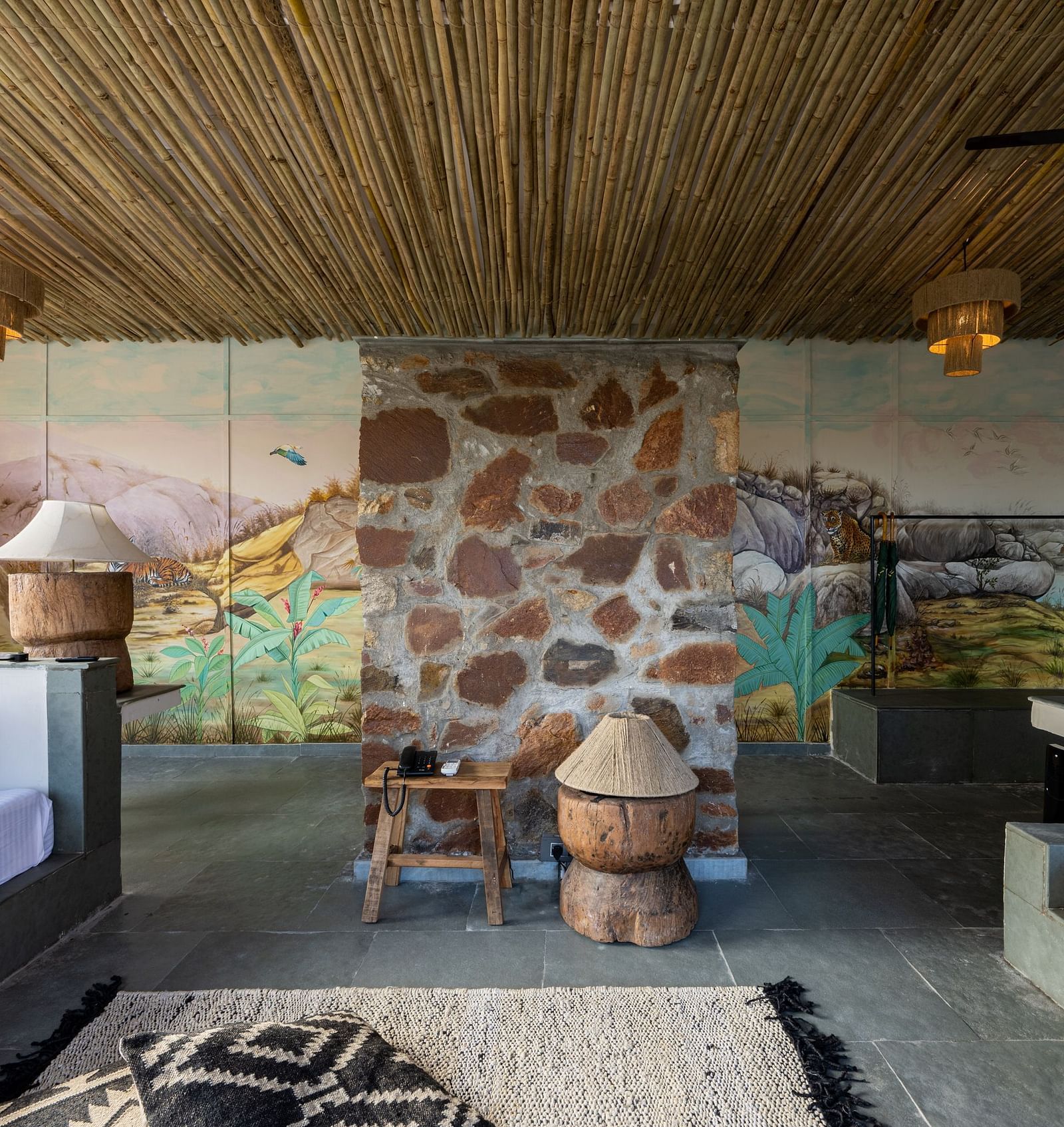 A view of our room with a bed on the left and sofas on the right - Utsav Camp
