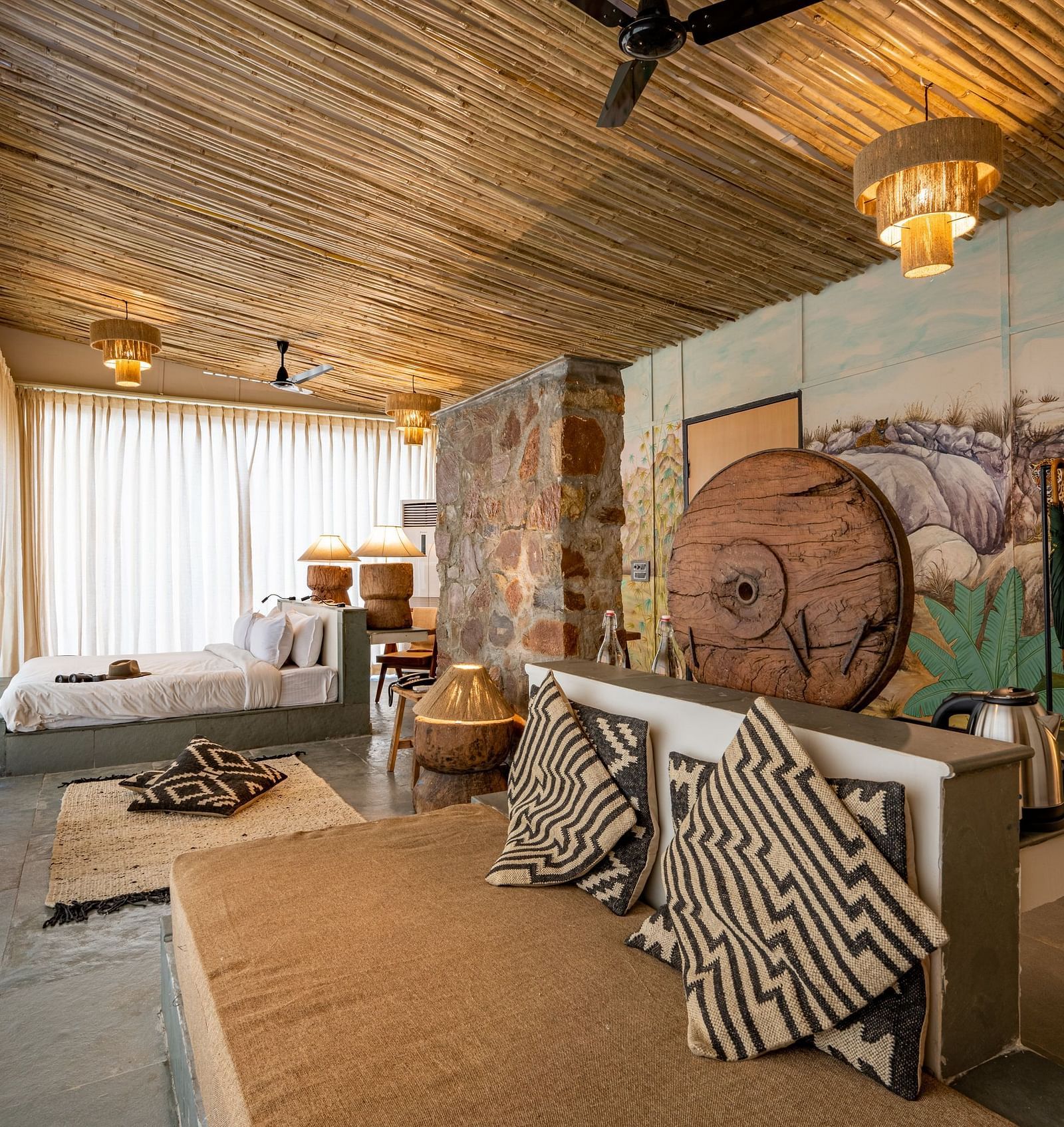 A view of our Forest Bungalow with comfortable sofas and large bed - Utsav Camp