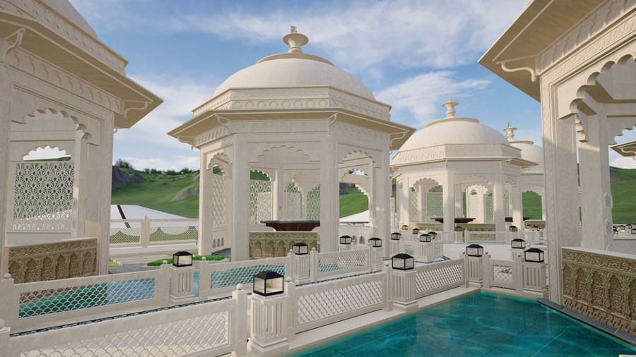 a wide angle shot that captures the essence of Panch Mahal. It features white gazebos with dome shaped roofs, courtyards with intricate patterns, and shallow pools with pristine water that runs through the courtyards - Kaldan Samudhra Palace