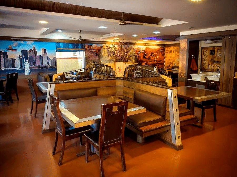 Picture of aroma resturant, featuring tables and chairs set for dining