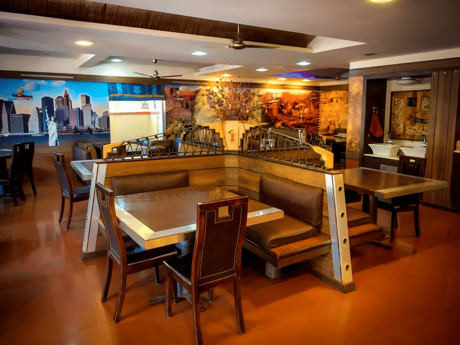 Picture of Aroma restaurant, featuring tables and chairs set for dining.