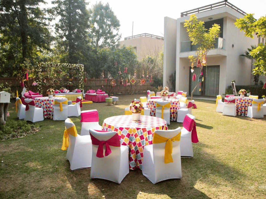 An overview of the outdoor seating arrangement for a wedding reception - Karma Lakelands.