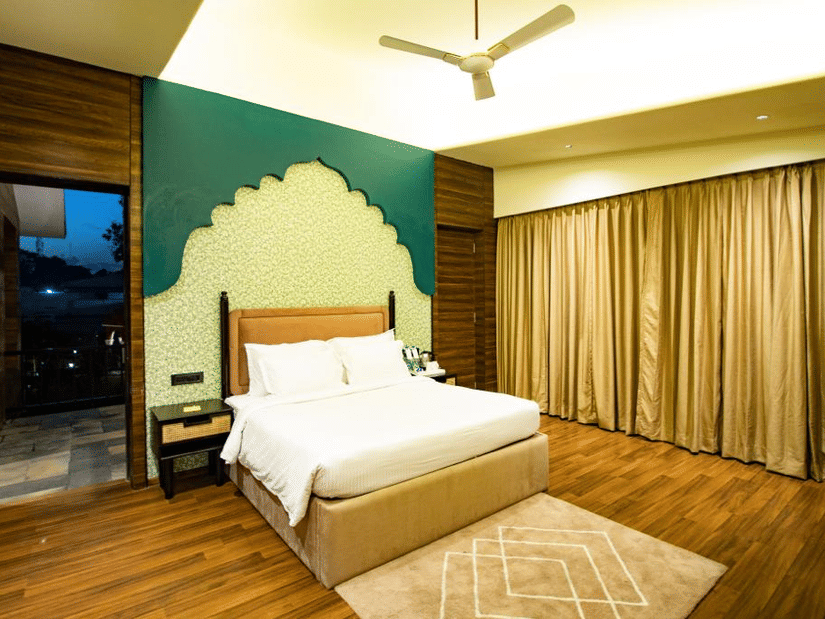 Luxury villa room with a cozy, spacious bed at Wedlock Greens Hotel & Resort, Dhanbad
