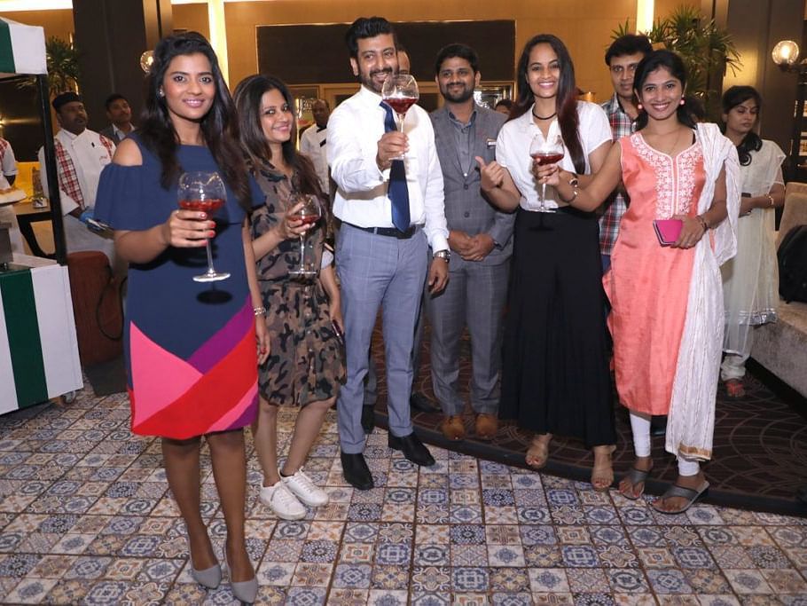 The staff celebrating with drinks on a special occasion.