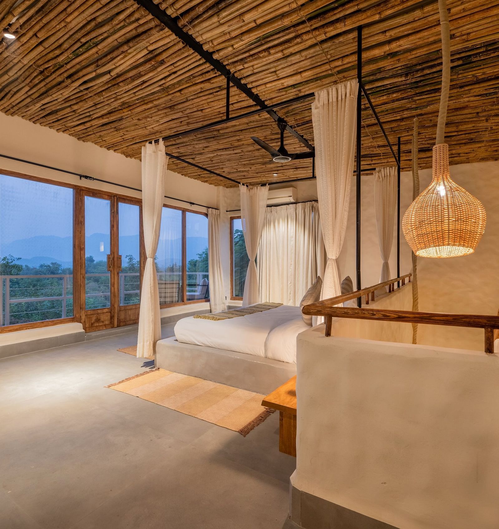 bedroom with large windows, natural wood accents, and minimalistic decor.