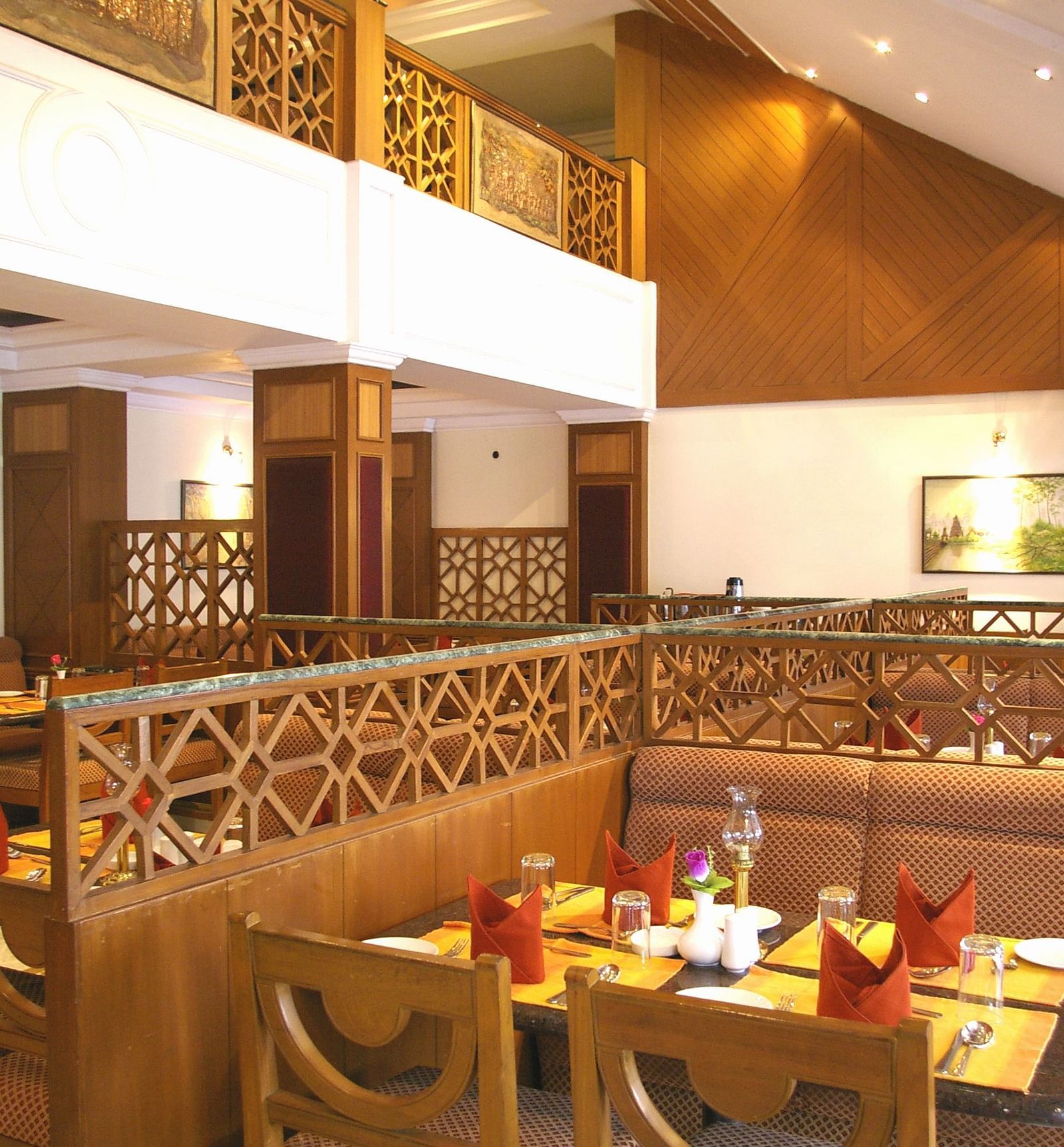 A dining seating of a restaurant at Regency Kanchipuram by GRT Hotels.