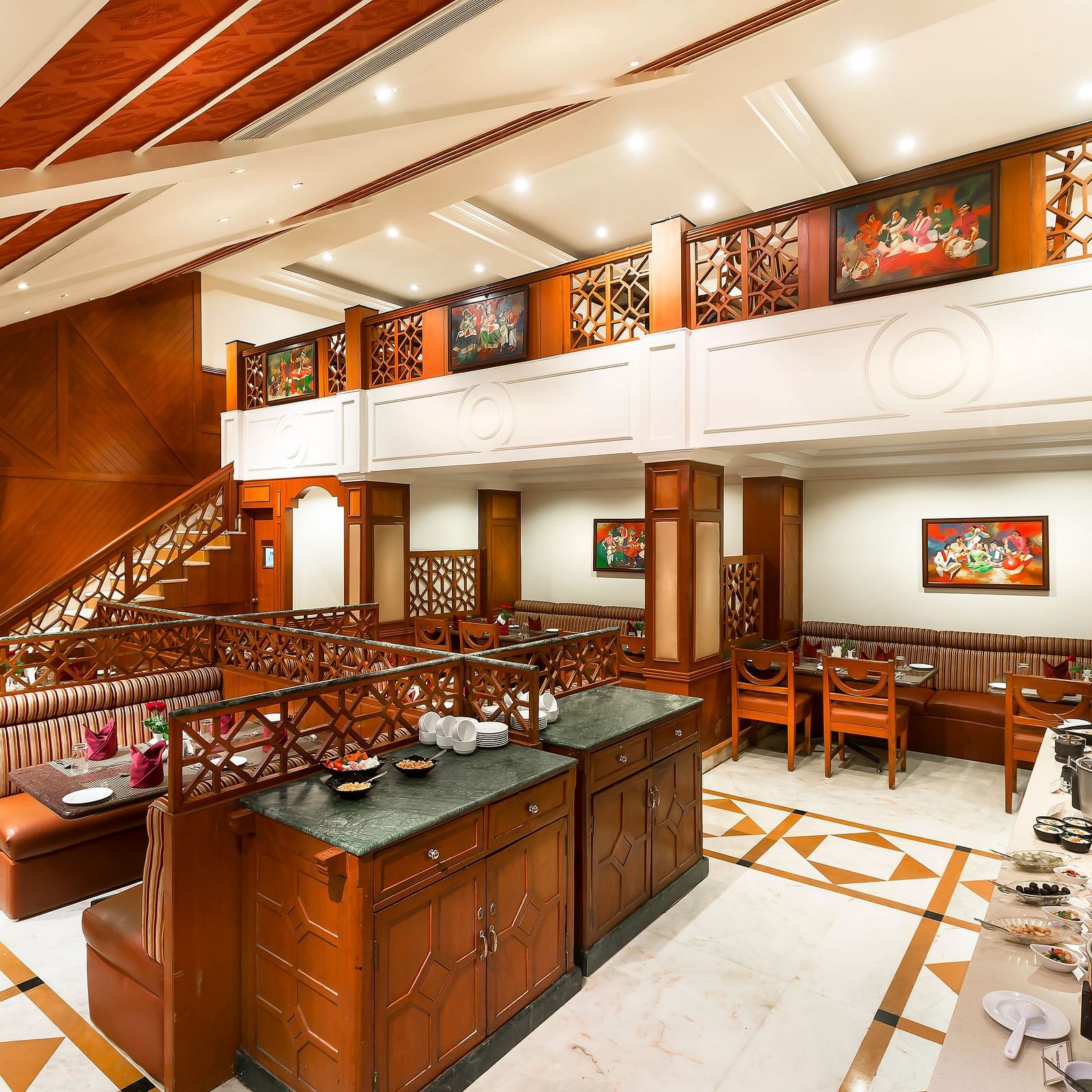 A seating arrangement of Dakshin Restaurant at Regency Kanchipuram by GRT Hotels.