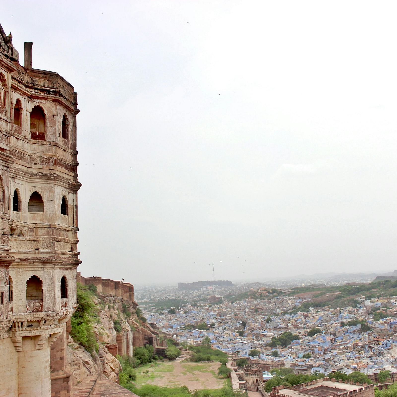 A partial view of Mehrangarh Fort’s facade overlooking the cityscape of Jodhpur.