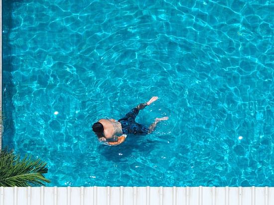 swimming-pool-blue-color-clear-water-people-enjoying-summer-sunny-day-top-view-angle
