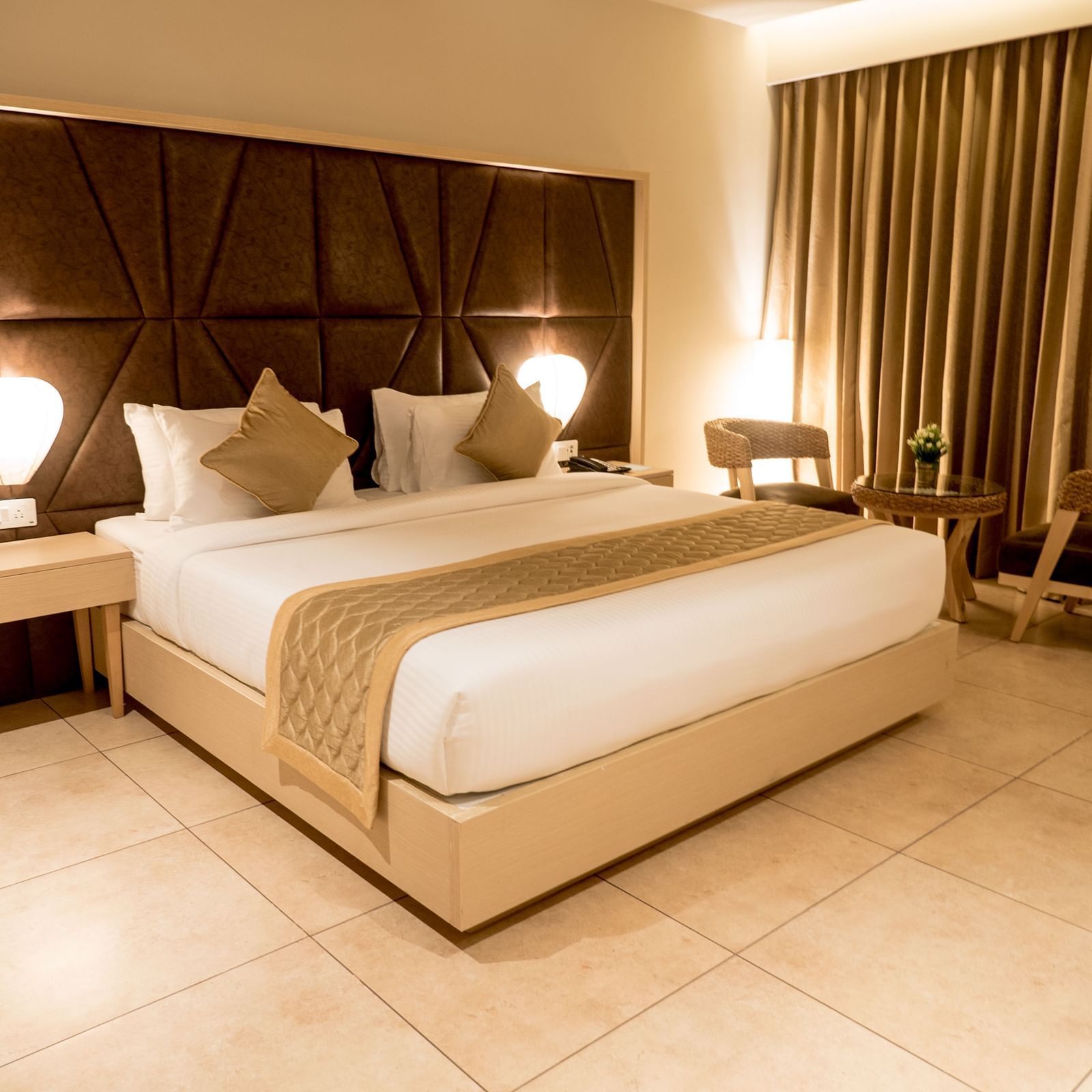 view of king size bed of Premium Room at Cholaa Dynasty, Kumbakonam