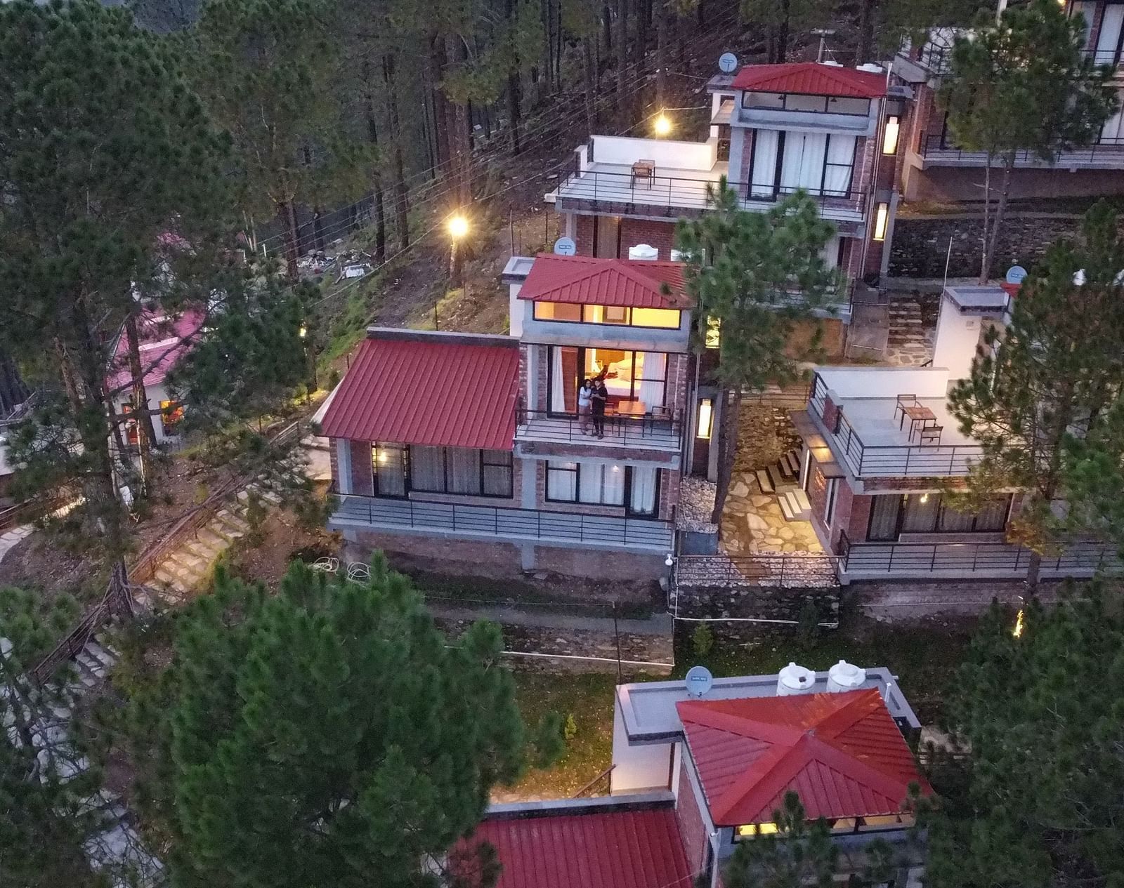 facade image of the BluSalzz Escapade Resort, Lansdowne surrounded by the trees.