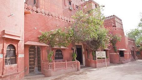 A collage of image of rooms and facade of Castle Awan