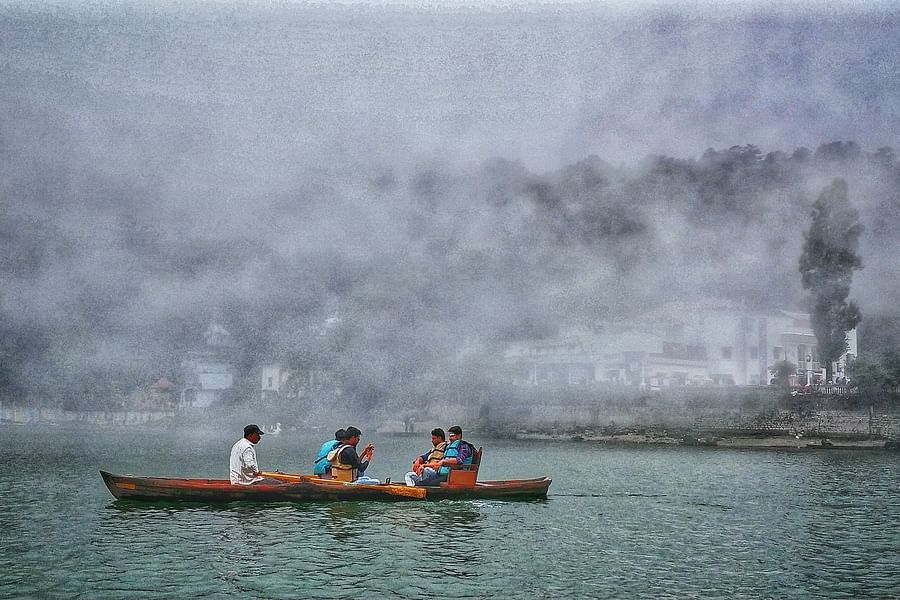 a group of people boating in a lake