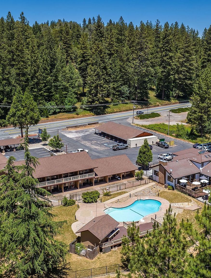 Aerial view of Amador Hotel with a view of the forest in the backdrop