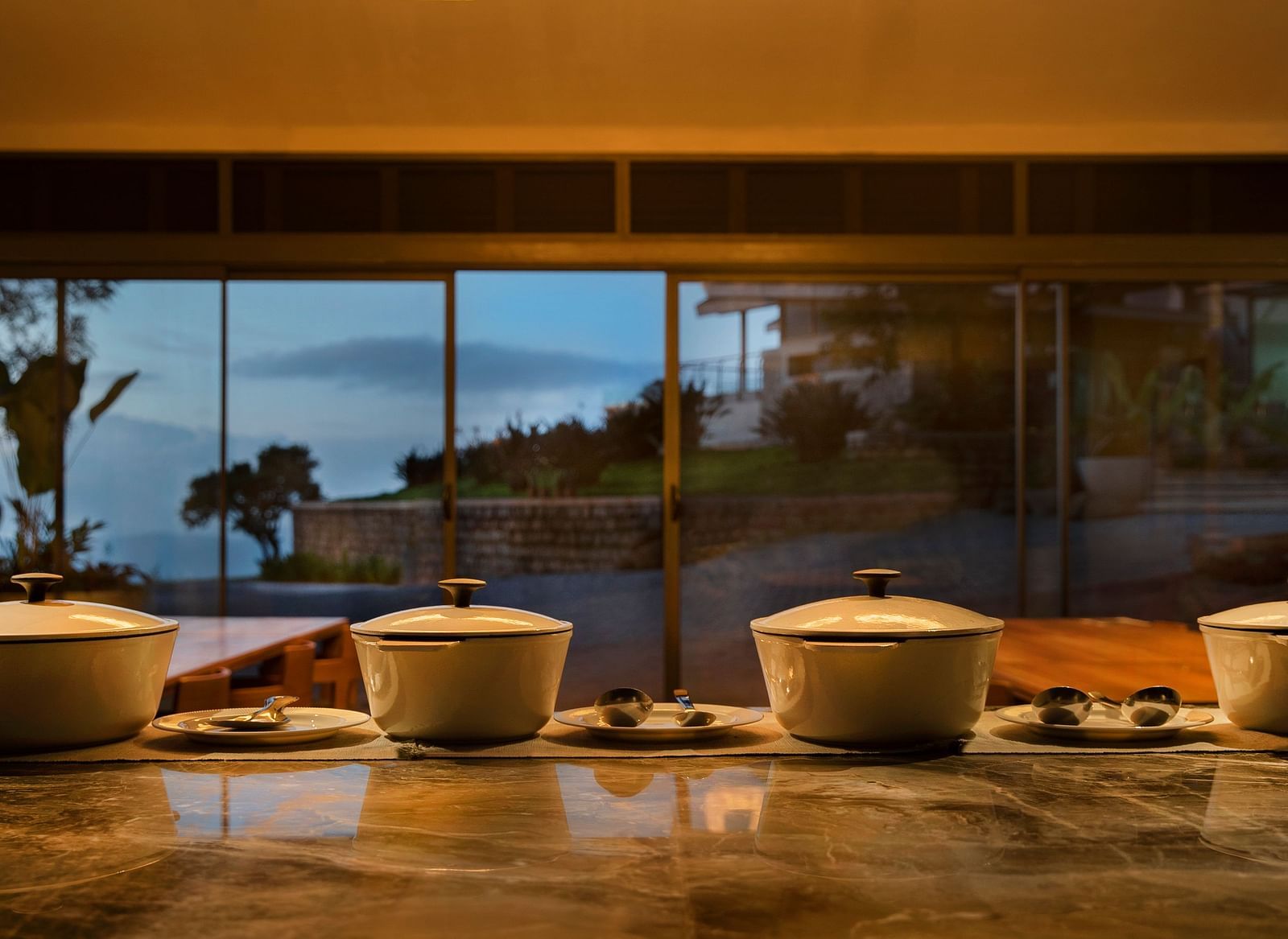 A counter table with four food containers placed on it at Stanley Revelation.