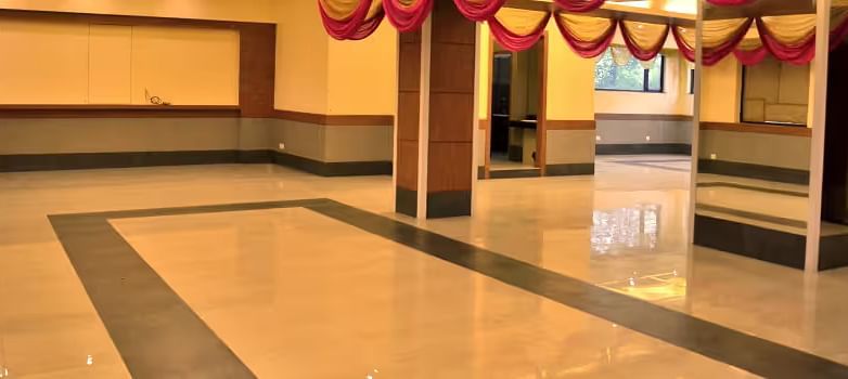 View of banquet hall called The Durbar with polished flooring and ample space for events - Max Hotel Prayagraj.