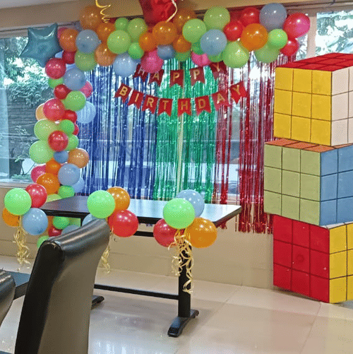 Conference room decorated with balloons and vibrant cube props at Central Hotels.