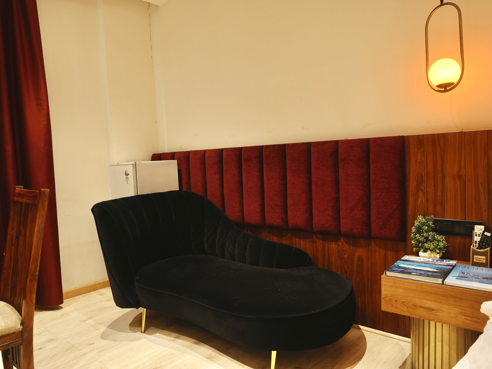 Club Suite, Black velvet chaise by the window