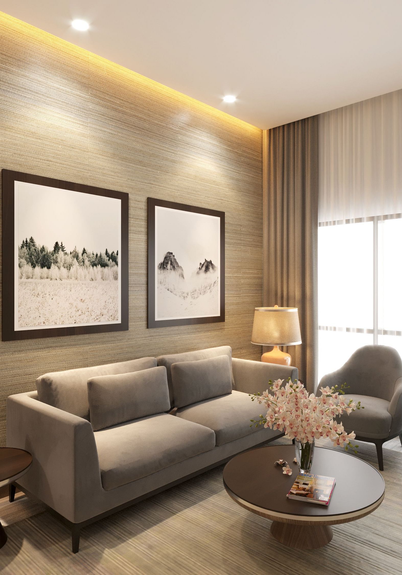 One Bedroom Suite in Kinshasa at Kertel Suites with a grey sofa set with two paintings hung over it