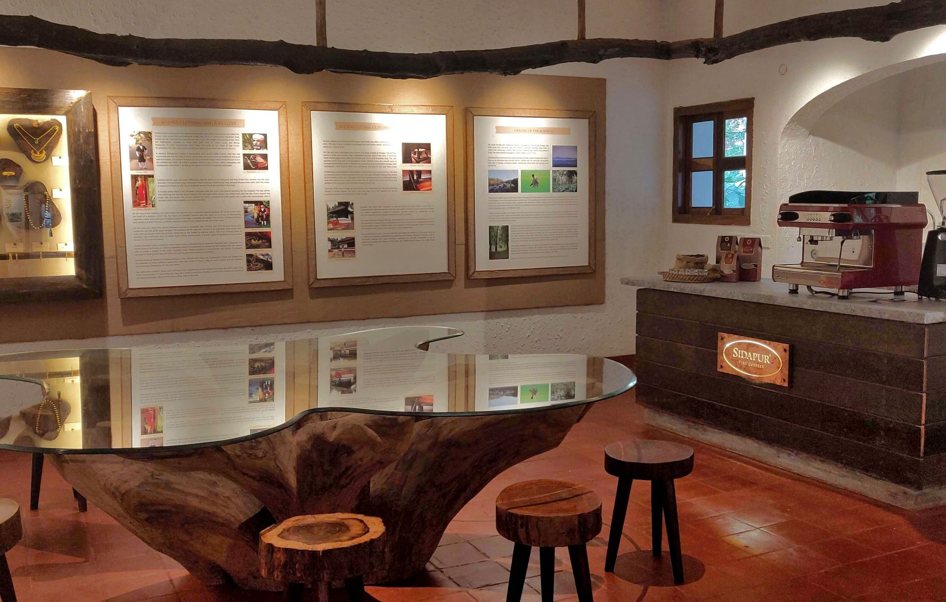 Interior of coffee museum with exhibits and a coffee machine.