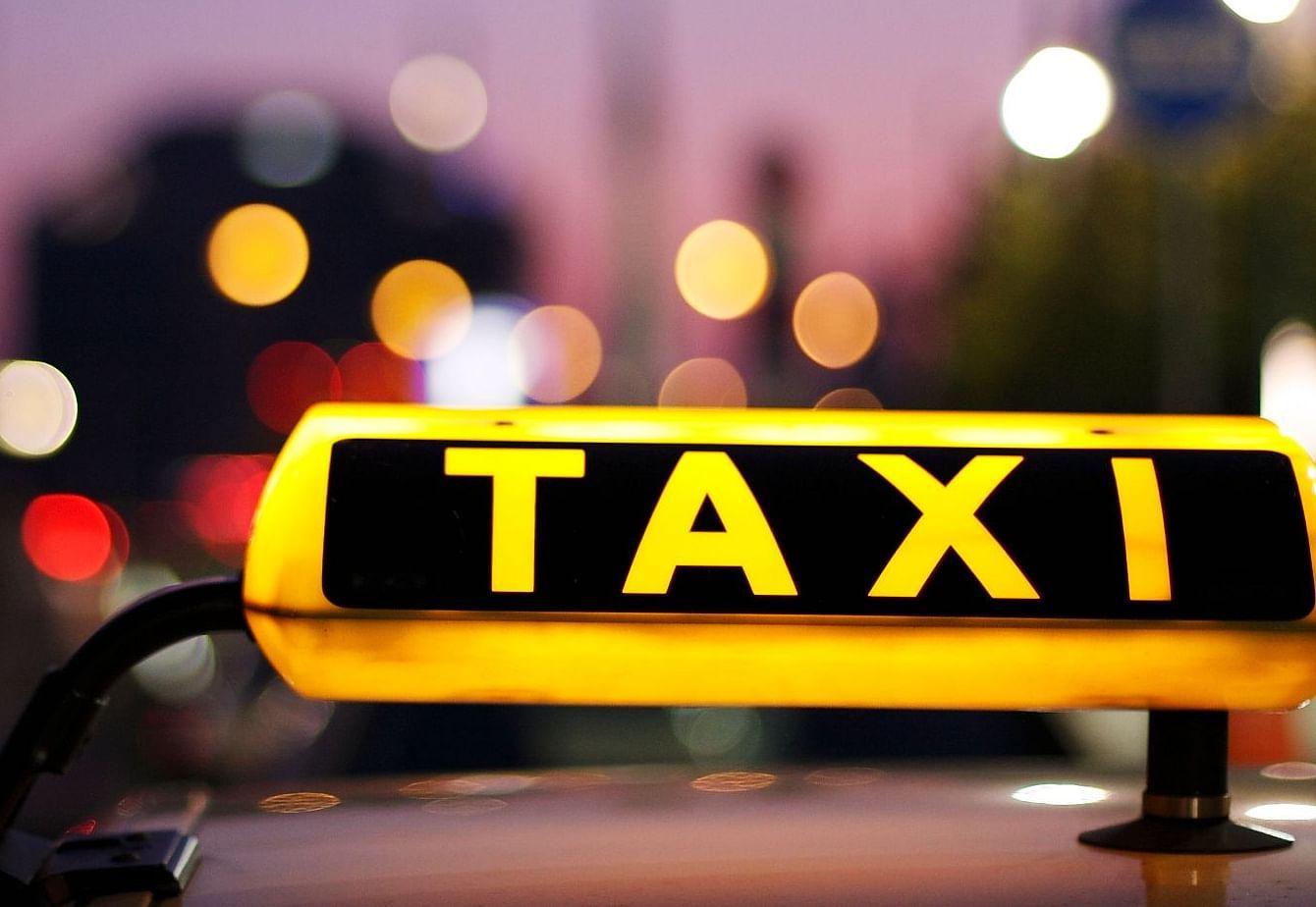 Image of a signage with taxi written on it.
