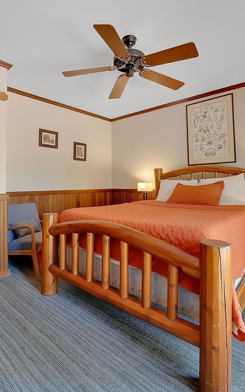 A view of a room at Narrow Gauge Inn with a double bed.