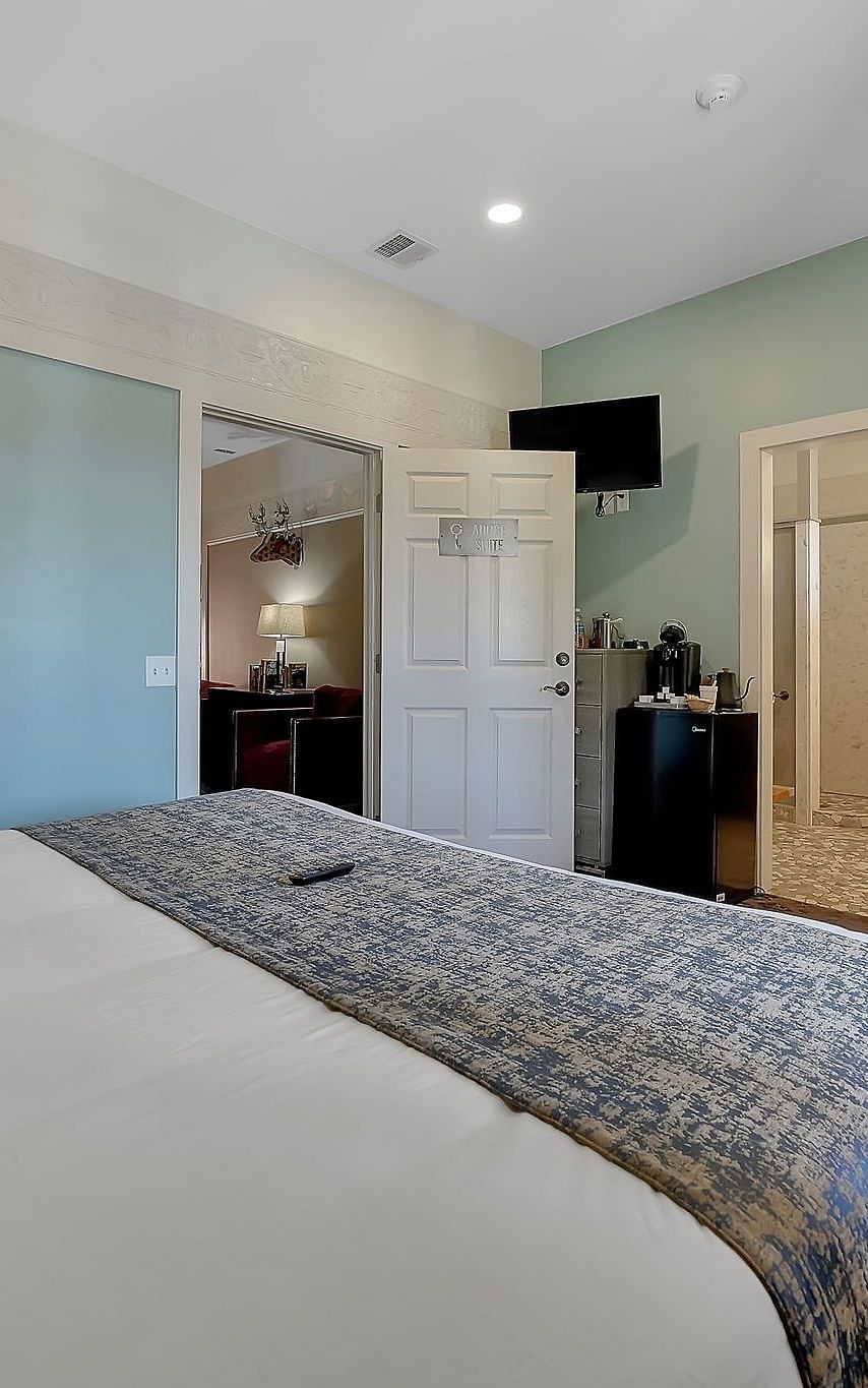 A view of a room at The Groveland Hotel with a double bed.
