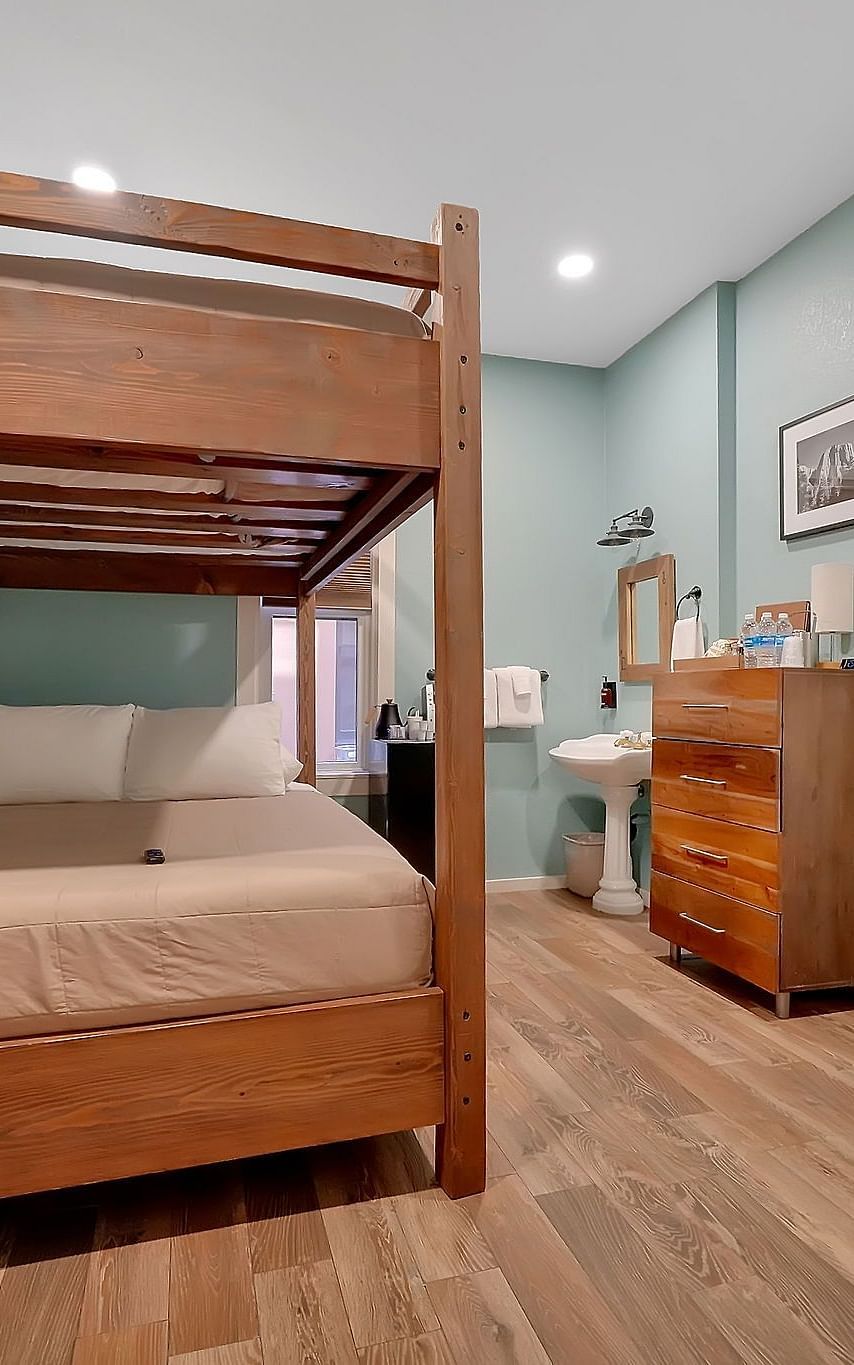 A view of a room at The Groveland Hotel with bunk beds.