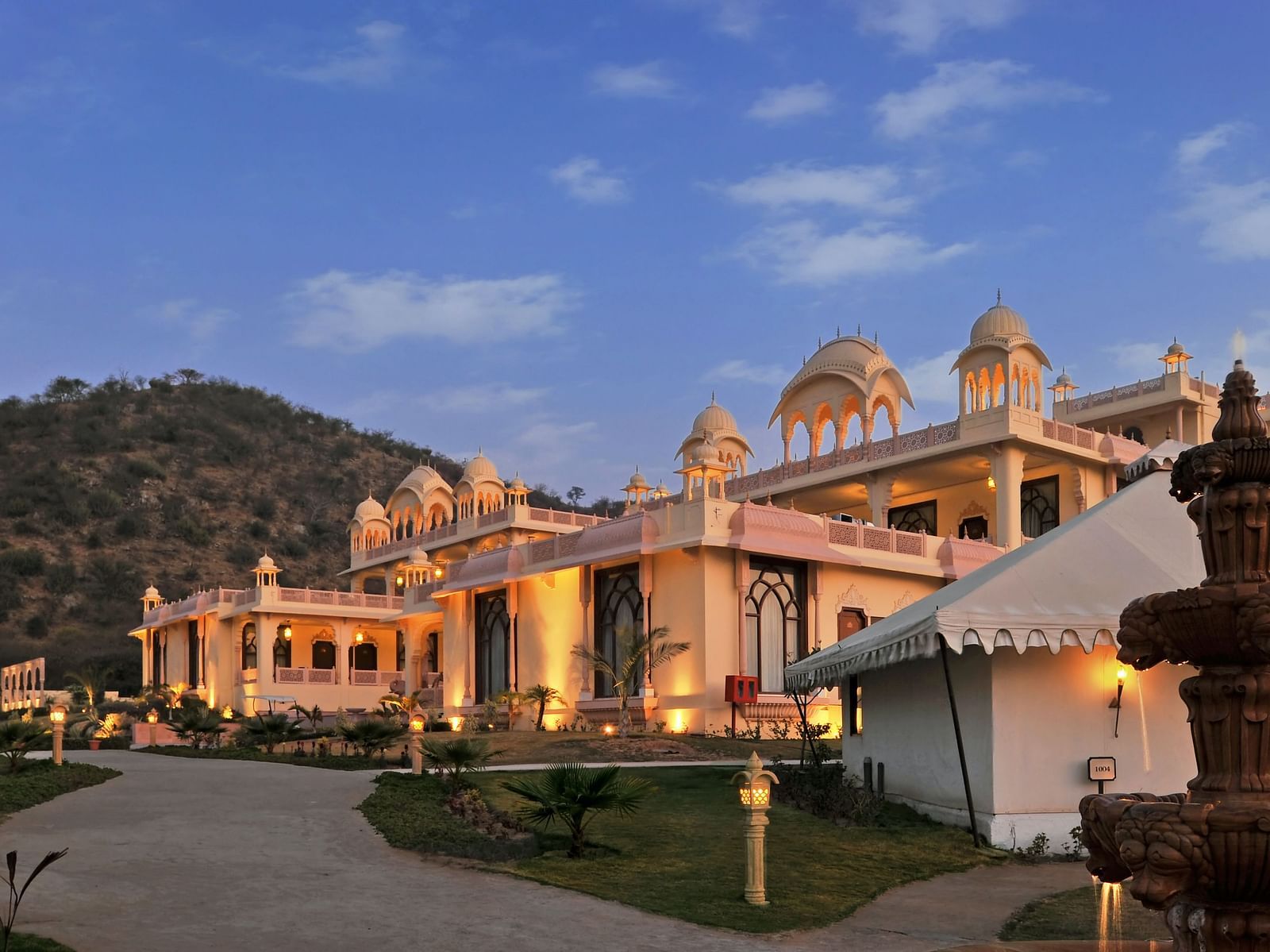 Facade of Rajasthali Resort & Spa Jaipur with a clear sky in the background.