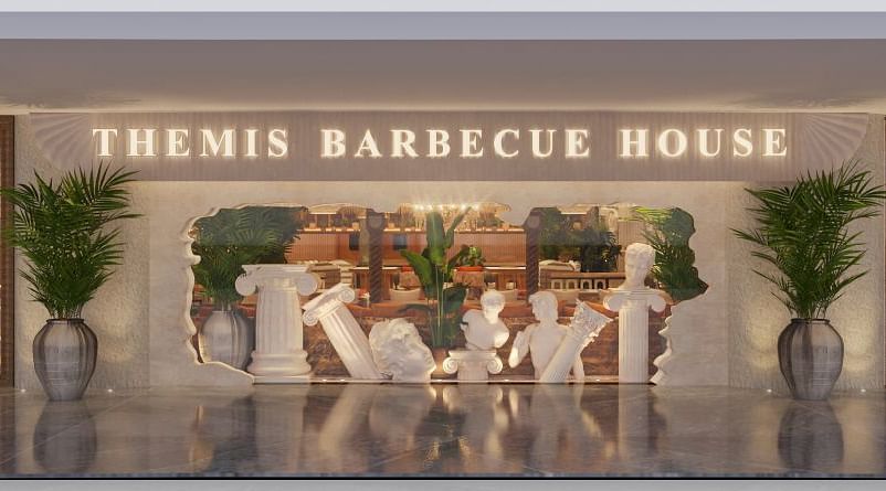 An image of a lobby with statues, sculptures, plants, and other decorative objects at Themis Barbecue House 