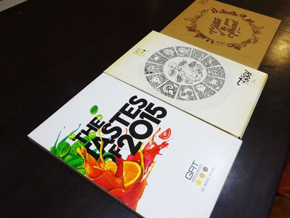 Set of printed materials with artistic designs displayed on a table.
