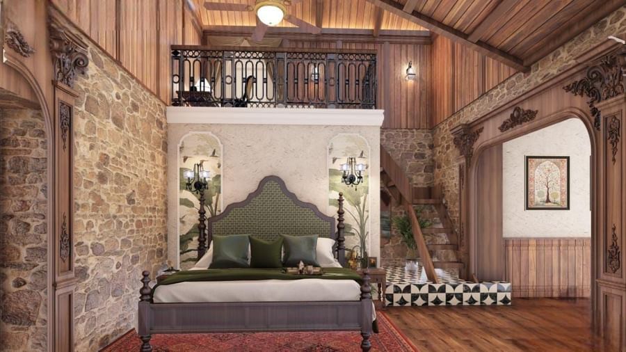 Cosy bedroom with a mezzanine level, exposed timber beams, and a stone accent wall, giving a cabin aesthetic at BluSalzz Terrah Hills Resort, Dalhousie.