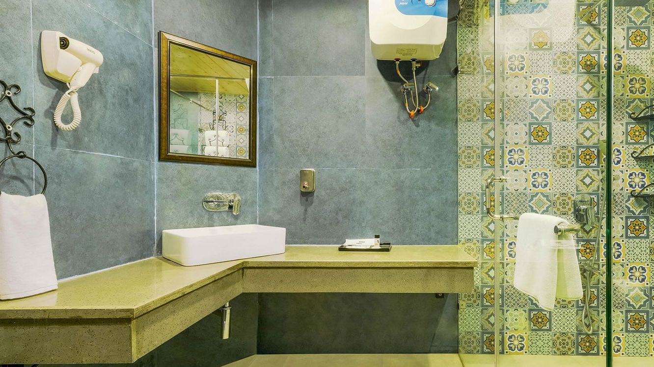 Image of a washroom with sink and modern amenites at Summit By The Ganges Beach Resort & Spa, Rishikesh