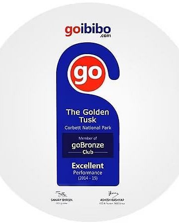 An emblem by Goibibo signifying a card hung on a door knob recognising the Golden Tusk Resort as an excellent performer for 2014-15.