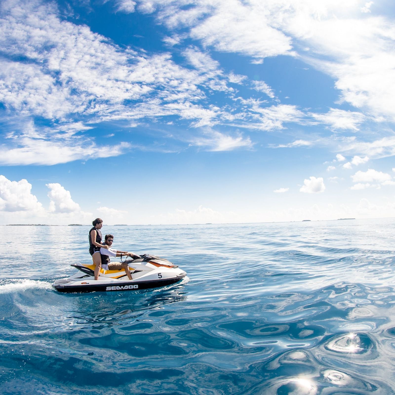 Speed boat with people on an ocean 