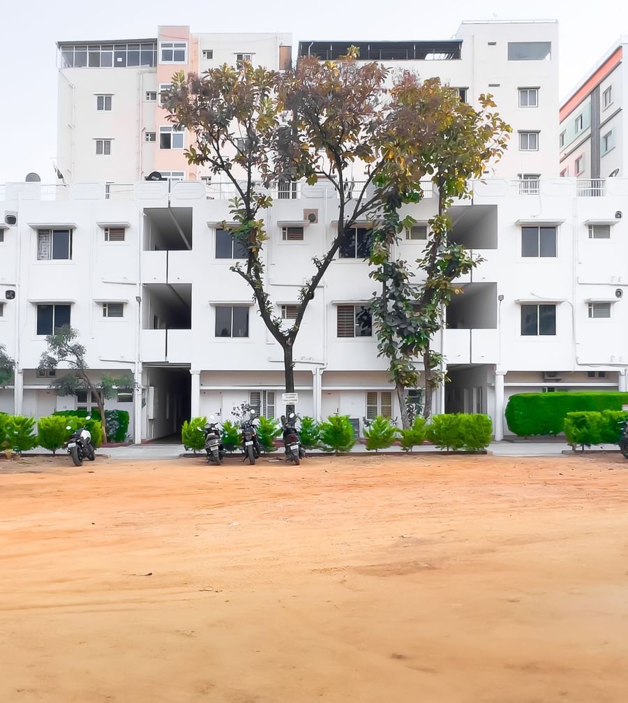 Wide outdoor area with apartment building in the background at The Pinnacle, Electronic City.