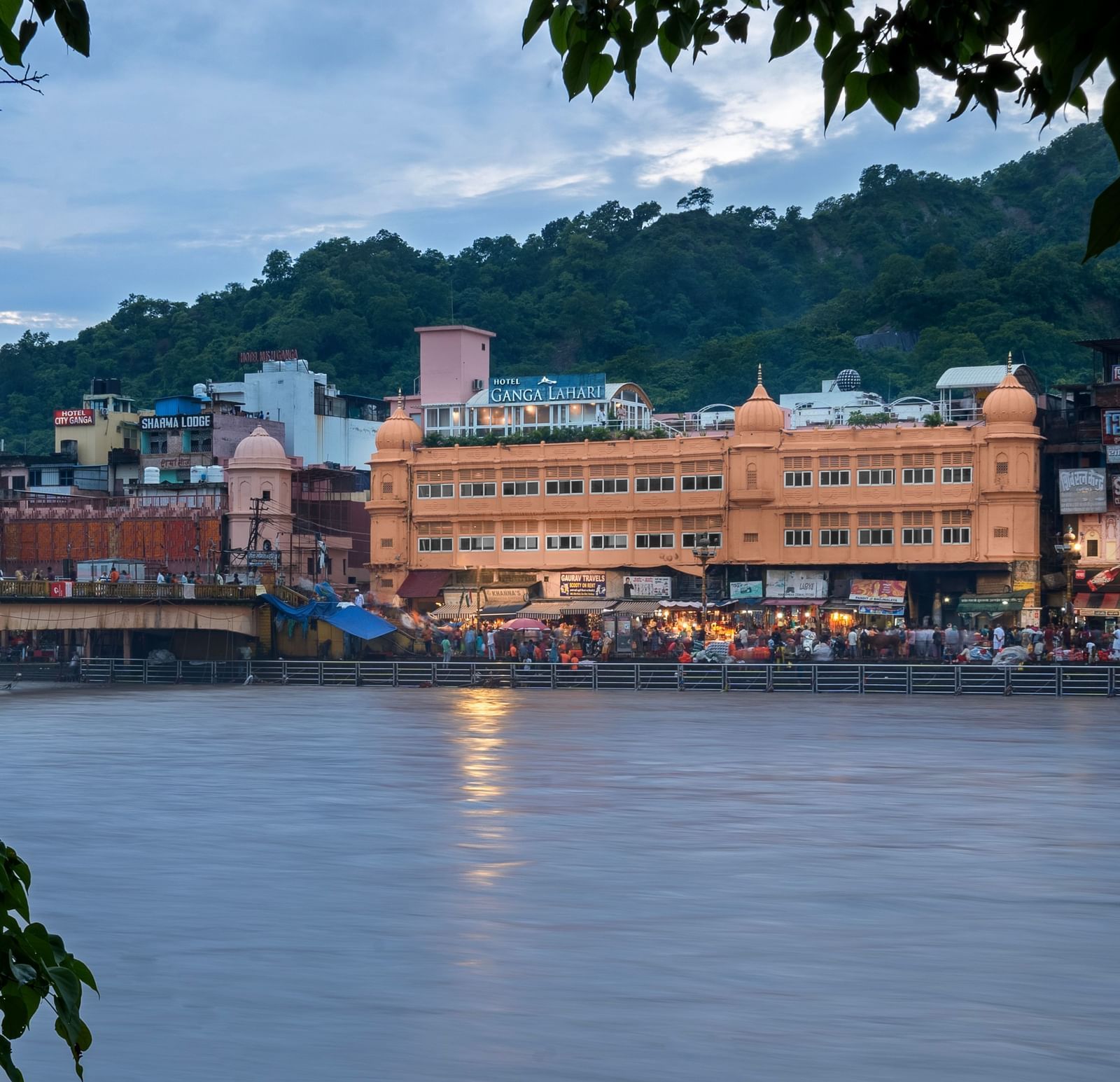 Facade shot during daytime from across the river - Ganga Lahari, Haridwar
