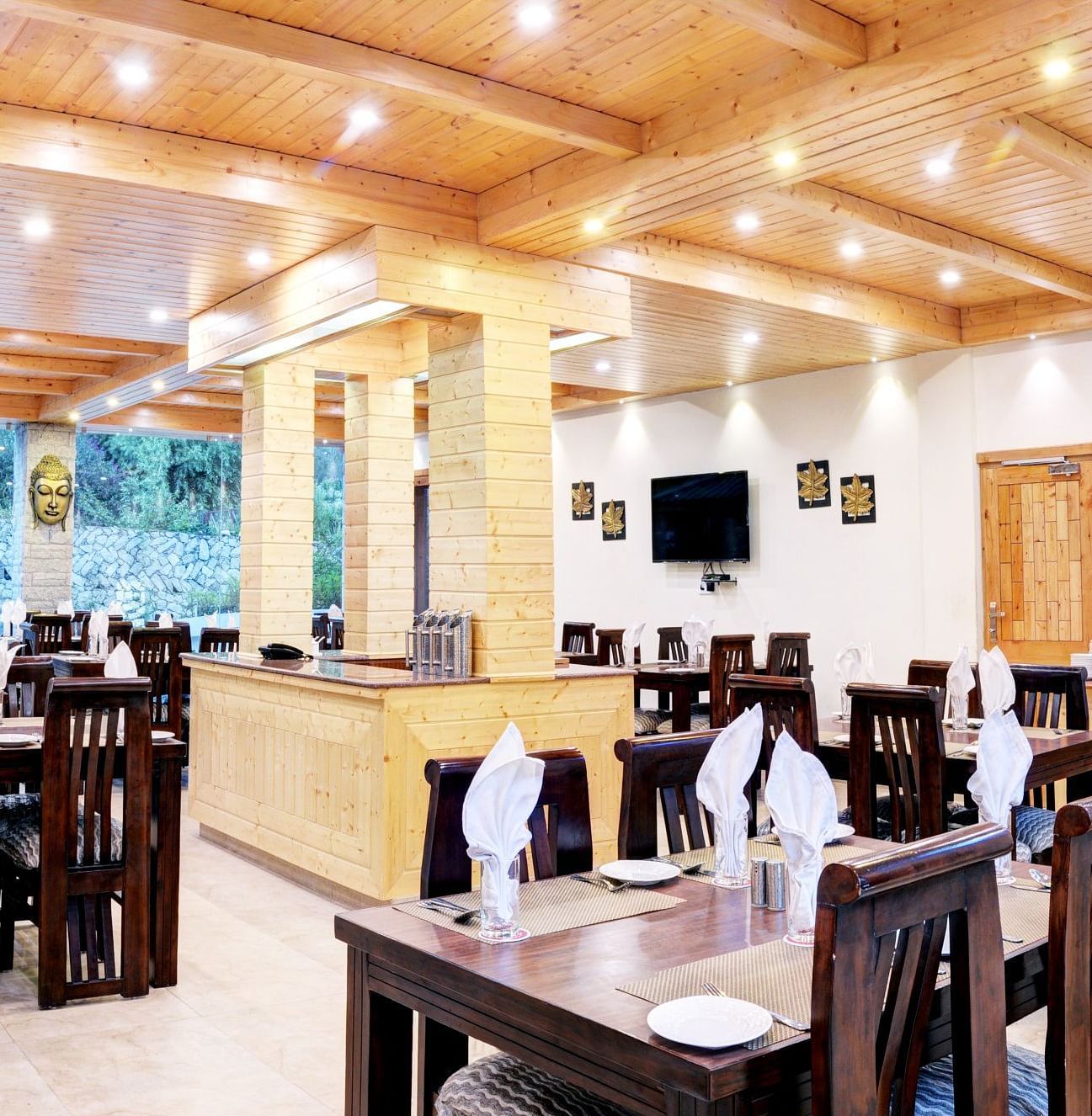 Image of a restaurant with tables and chairs at Summit Chandertal Regency Hotel & Spa