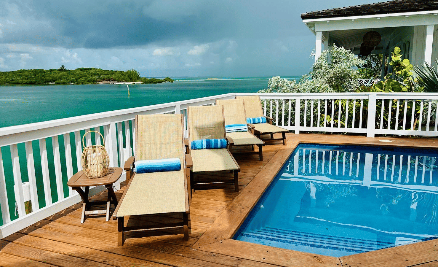 A view of a deck and a small pool at Elbow Room Villa 7 in Abaco inn with seating area and picturesque view