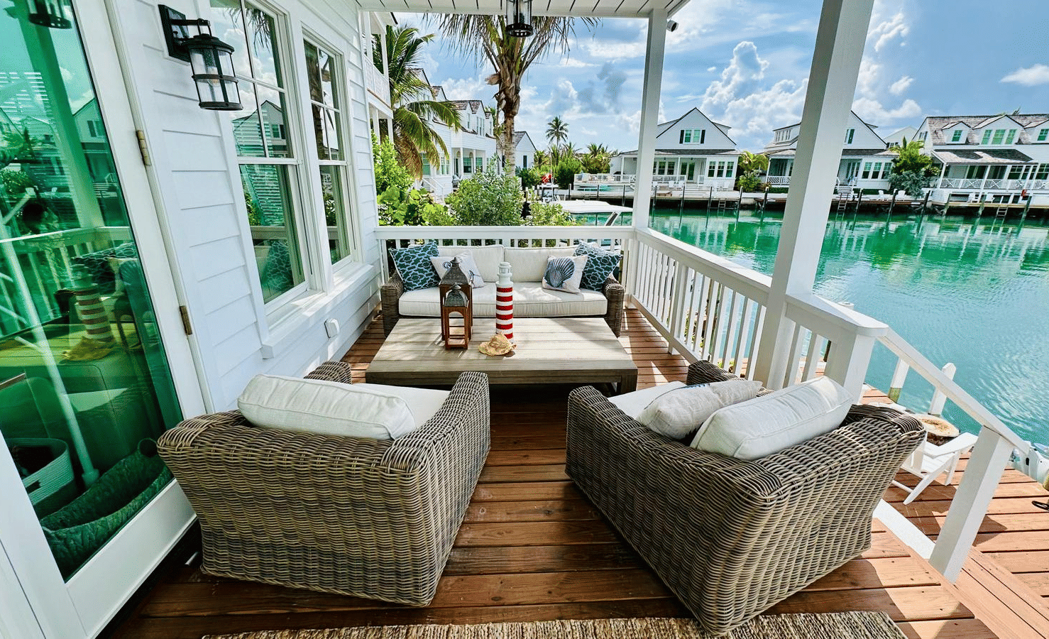 A view of a deck of Elbow Room Villa 7 in Abaco inn with a seating area