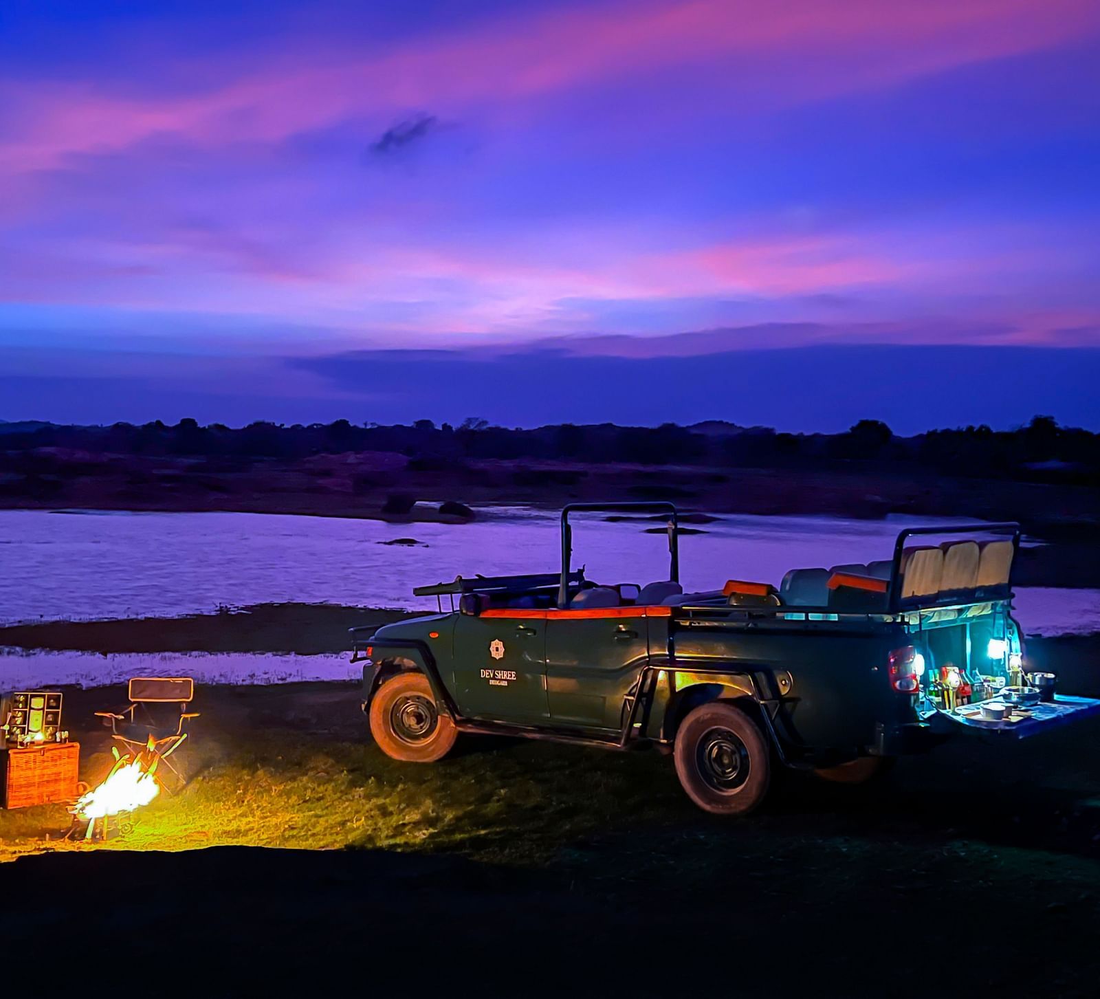 image showing the camping experience near a lake at Sunset at dev shree, deogarh