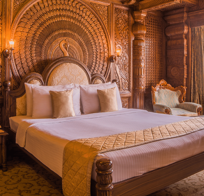 Room at Sitara Luxury Hotel in Hyderabad near Ramoji Film City with a double bed and side tables